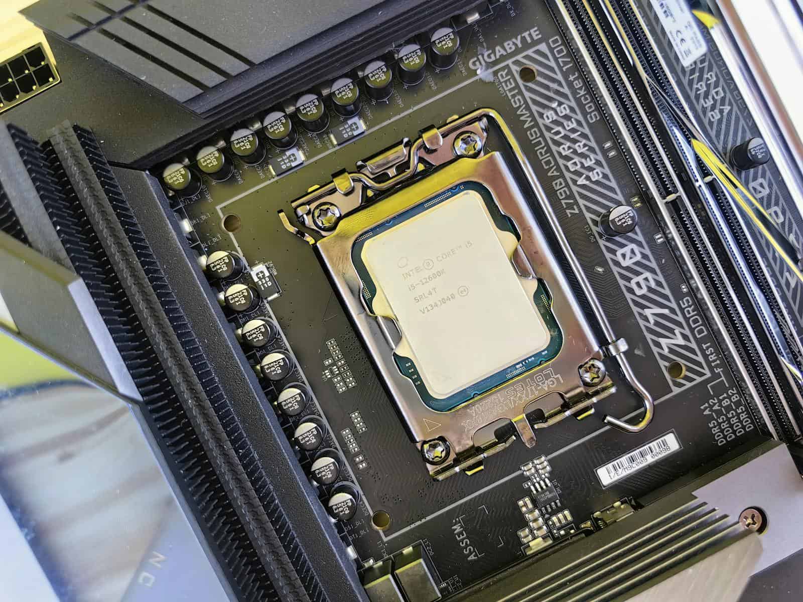 Close-up of a CPU securely mounted on a high-performance motherboard in a computer build.