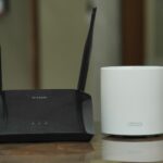 a couple of routers sitting on top of a table