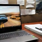 macbook pro on brown wooden table