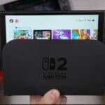 A nintendo switch is docked and on.