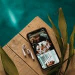 black iphone 4 on brown wooden table