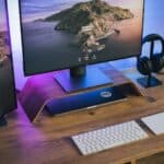 silver imac on brown wooden desk