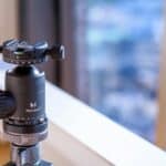 a tripod with a camera attached to it