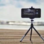 black smartphone near shore