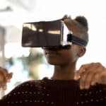 a woman wearing a virtual reality headset