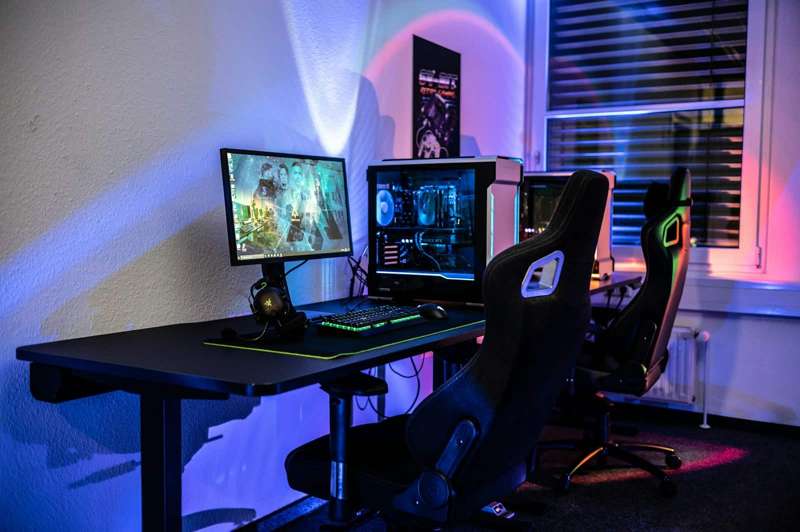 a computer desk with two monitors and a keyboard