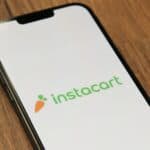 a phone with the instocart logo on it