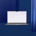 a laptop computer sitting on top of a blue floor