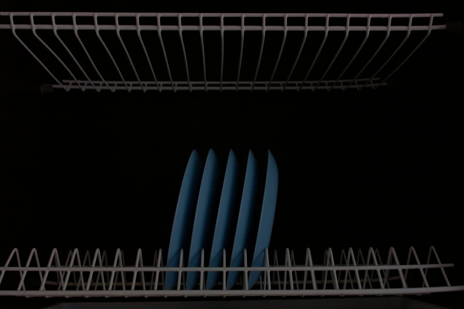 a close up of a dish rack in a kitchen