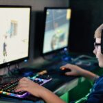 boy wearing headset playing computer game