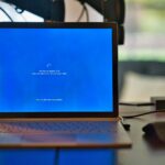 macbook pro on brown wooden table